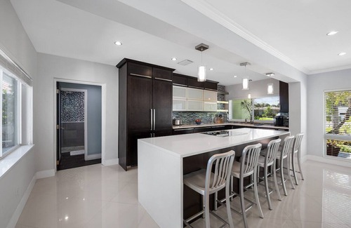 Central Fort Lauderdale Casa | Just 10min to downtown Ft. Lauderdale & beach, this modern home offers everything a group could want for an upscale relaxing getaway. Unwind in the very private and peaceful backyard oasis, featuring a heated ($) pool, 6-person hot tub & fire pit.