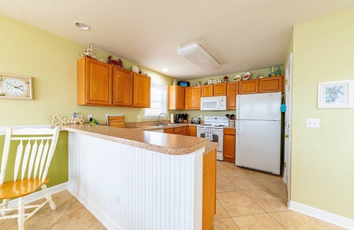 Colington Harbour Casa | K1552 BeachBumz. Gran Canalfront Home con piscina comunitaria.