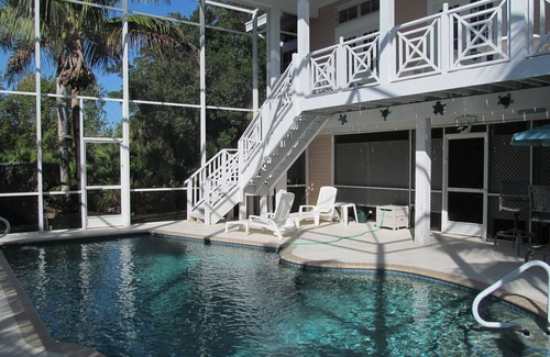 Sanibel Casa | Clave casa de estilo occidental. 3 dormitorios y 2 baños con piscina climatizada blindado. A pie de playa