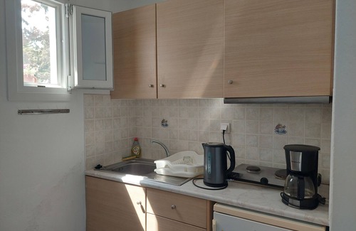 Chrissi Akti Casa | Apartamento reformado de Kikis, una terraza de ensueño