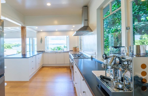 Omiha Casa | Koi Waiheke - Koi Waiheke is a stunning luxury holiday home in Omiha, Waiheke Island. With 4 bedrooms; 4 bathrooms; a large entertainer’s kitchen; spectacular ocean views; a private mooring; and a boat shed offering direct access to the ocean. This i