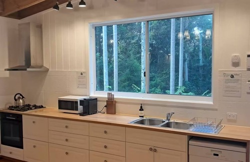 Springbrook Casa | Cosy Romantic Rainforest Luxury Cottage in Springbrook-waterfalls, fireplace