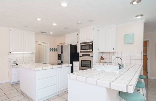 Silver Sands Casa | Lagoon Hideaway | Waterfront 4BR Home, Pool, Dock, Game Room, Short Walk to Beac