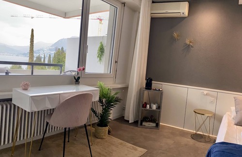 Bissone Apartamento | Lake view apartment with terrace, outdoor pool and parking space