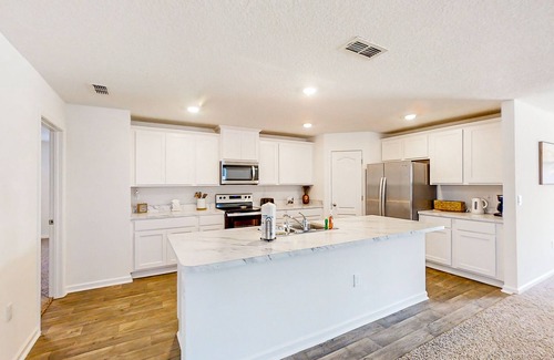 Northside Casa | Lake-view home with central AC, streaming, washer/dryer, patio, & full kitchen