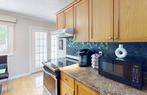 Wasaga Beach Casa | Lakefront condo steps to the beach with pool, and fireplace