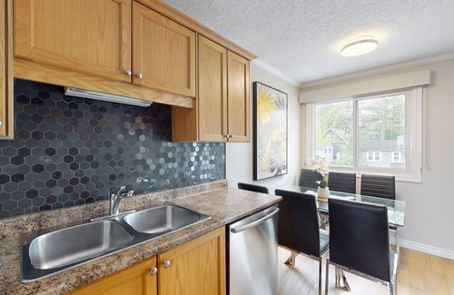 Wasaga Beach Casa | Lakefront condo steps to the beach with pool, and fireplace