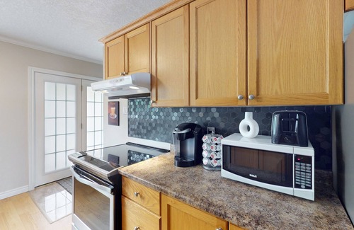 Wasaga Beach Casa | Lakefront condo steps to the beach with pool, and fireplace