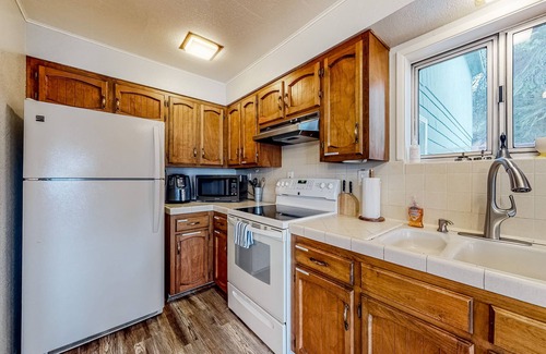 Dunes City Casa | Lakefront dream with private hot tub, dock, kayaks, pedal boat & amazing views