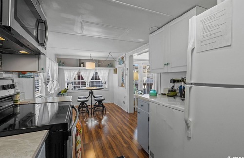 Surfside Beach Complejo | Large outdoor area straight shot to the beach. Stocked coffee bar with expresso!
