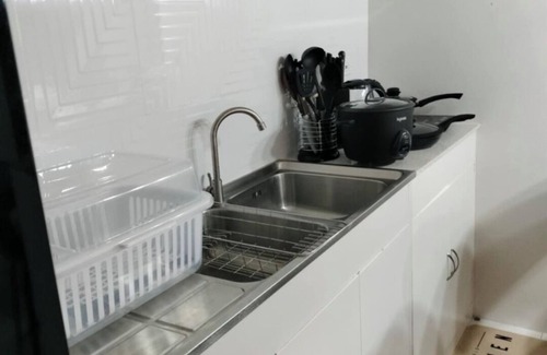 Naga Condominio | Léo's Cachette: Your Modern Cityscape of Comfort and Convenience in Naga City