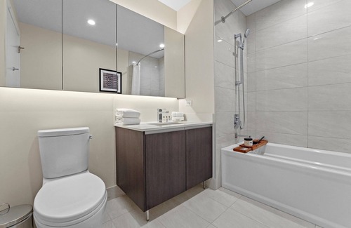 Near North Side Hotel | Level Old Town - Two Bedroom Suite with full kitchen, living room, and laundry