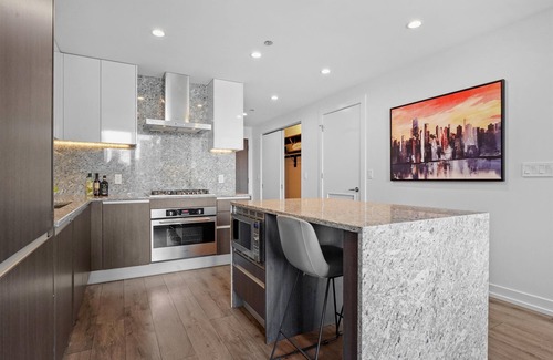 Near North Side Hotel | Level Old Town - Two Bedroom Suite with full kitchen, living room, and laundry