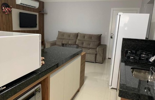Piratuba Apartamento | Lindo Apto NOVO na Avenida, climatizado e aconchegante