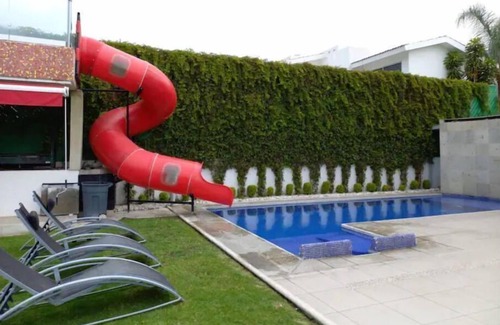 Zama Villa | Lively villa with pool, waterfall, and slide