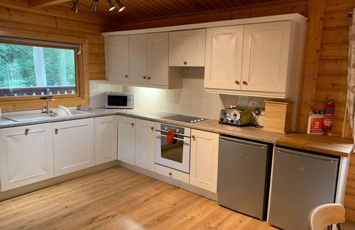 Louth Cabina | Log cabin with veranda, nestled in Kenwick Park, Louth