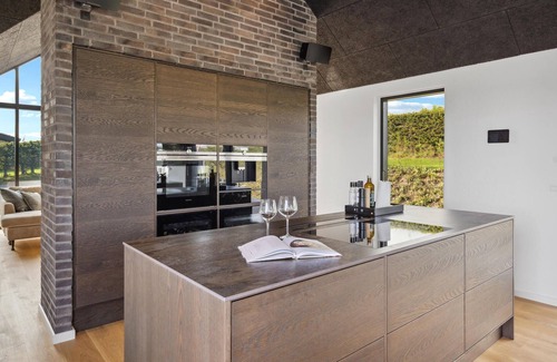 Hejlsminde Strand Casa | Look forward to a beautiful sea view in this attractive vacation home with outdoor wellness.