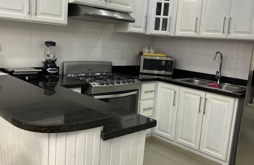 Gregorio Luperon Apartamento | Lovely and cozy home with pool and GYM. Located near major Bars and Restaurants