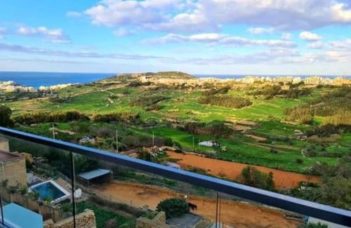 Xaghra Apartamento | Lovely home with beautiful view with communal pool by 360 Estates