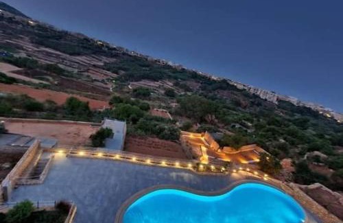 Xaghra Apartamento | Lovely home with beautiful view with communal pool by 360 Estates