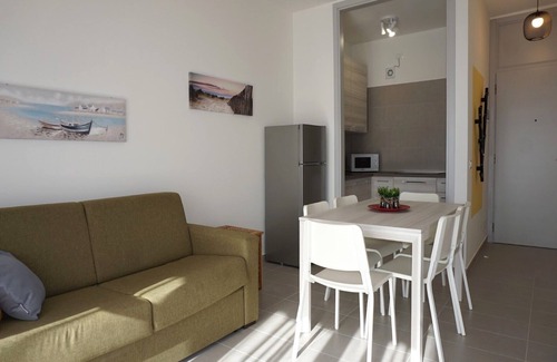 Porto Santa Margherita Apartamento | Precioso piso con balcón y piscina compartida.