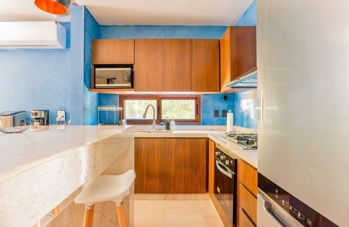 Xpu-Ha Apartamento | Lower level apartment with high-speed internet pool, gym, & tennis courts