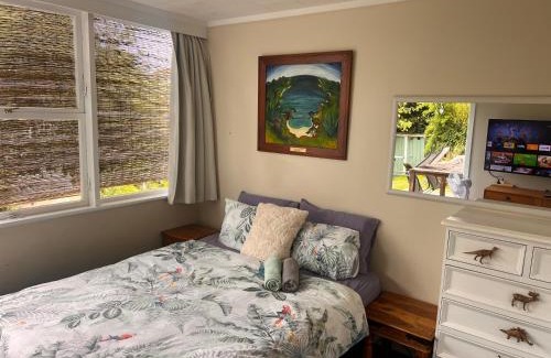 Remuera Casa | Lower level unit in the backyard, past the gate on the right of house