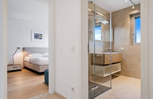Gasperich Apartamento | Lux City Escape: 2BR Apt with Balcony & Workspace