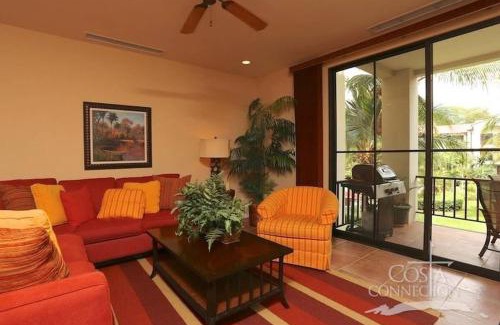 Coco Casa | Luxe! Impressively designed 2nd-floor unit in Coco done in red and orange hues