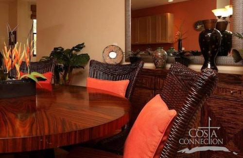 Coco Casa | Luxe! Impressively designed 2nd-floor unit in Coco done in red and orange hues