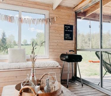 Nye Casa | Luxurious red cottage with wood stove near lake