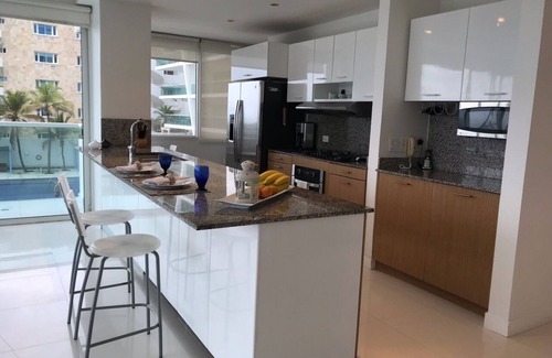 La Boquilla Condominio | Pasos de lujo y confort de la playa, 3 piscinas! Cocinero gourmet y familiar!