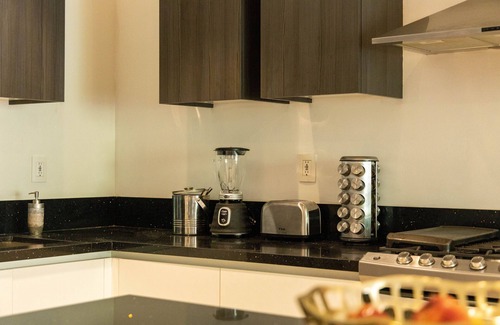 Colonia El Progreso Condominio | Luxury Condo in Gated Community with Resort Amenities minutes from the Marina