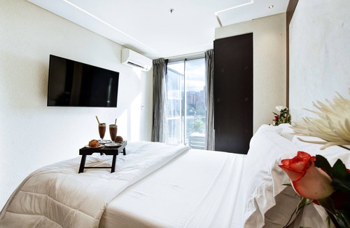 El Poblado Hotel | Habitación de lujo con vistas increíbles y balcón