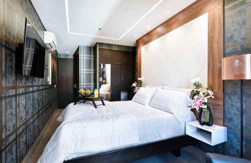 El Poblado Hotel | Habitación de lujo con ventana