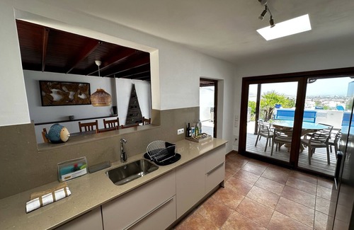 Playa Blanca Villa | Luxury villa - with a heated pool, hot tub, sea views, aircon, WiFi, UK TV