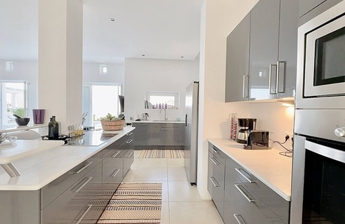 Kostos Villa | Luxury villa with pool in the middle of an olive grove and dream view of the sea