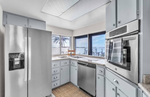St. Petersburg - Clearwater Casa | Luxury Waterfront Farmhouse Retreat w/Saltwater Pool, Dock & Tiki Bar