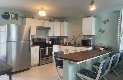 Bajo Casa | Malecon Beach House with beautiful backyard. Steps from the Caribbean ocean.