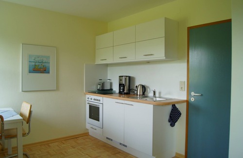 Strande Apartamento | Estilo marítimo con vistas a los prados en un entorno tranquilo.