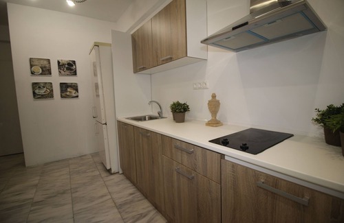 Ilisia Apartamento | Megaron naranja plana