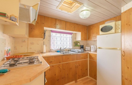 La Tremblade Alquiler De RV | Mobilhome 'Mobilhome Mh343' con piscina compartida, terraza privada y jardín privado