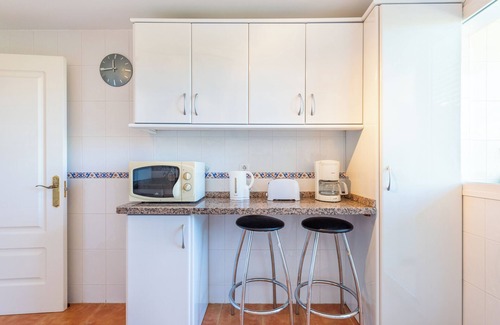 La Cala de Mijas Apartamento | Moderno apartamento 'In Jardin Botanico' con vistas al mar, piscina, Wi-Fi, jardín y terraza.