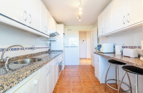 La Cala de Mijas Apartamento | Moderno apartamento 'In Jardin Botanico' con vistas al mar, piscina, Wi-Fi, jardín y terraza.
