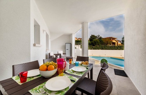 Monte Petrosu Apartamento | moderno apartamento a 5 min del mar con piscina, aire acondicionado y wi-fi