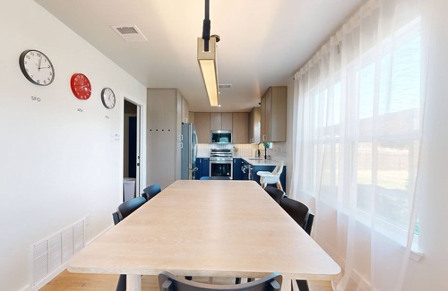 Scofield Farms Casa | Modern home with an enclosed backyard with wood fire pit in North Austin