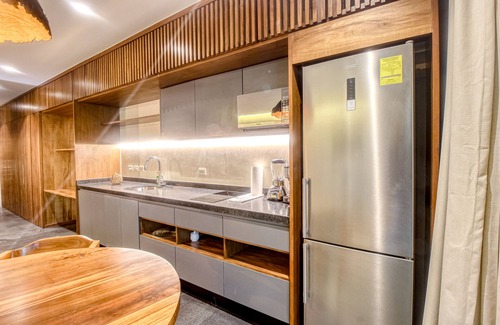 Zama Apartamento | Modern second floor studio with pool, partial AC, and balcony