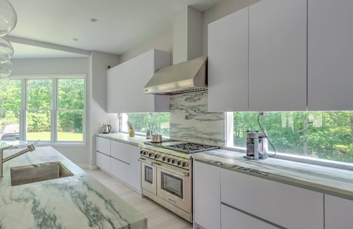 Amagansett North Casa | Modern-style home with heated private pool, open-floor plan, ample natural...