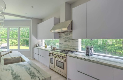 Amagansett North Casa | Modern-style home with heated private pool, open-floor plan, ample natural...