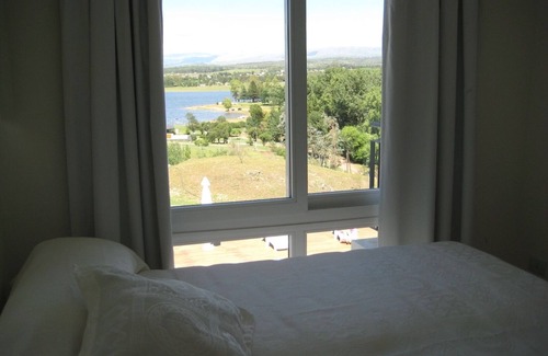 Alta Gracia Apartamento | Condominio Monte Molinos, 1 dormitorio con vista al lago y piscinas, T. Galeon